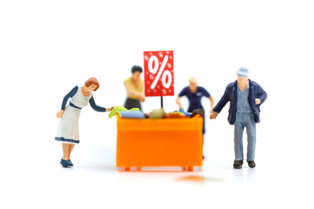 Miniature people : with discount for shopping items,Business and shopping concept.の写真素材