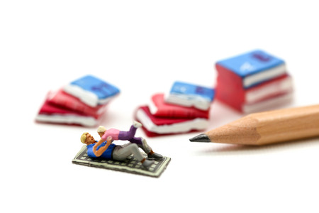 Miniature people : Father and son playing with book,enjoy and education concept.