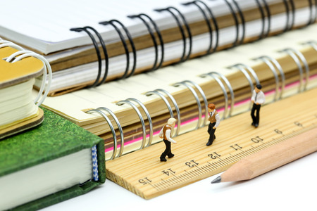 Miniature people : Teacher and children with book and school background. Back to school , Education concept.の写真素材