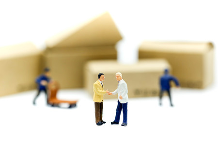 Miniature people : businessmen hand checking, standing in front of  Worker and box using as background shipping, rent container, business concept.の写真素材
