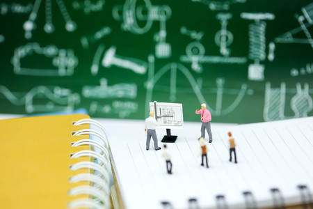 Miniature people : Teacher and children with book and school background. Back to school , Education concept.の写真素材