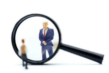 Miniature people : young businessman with magnifying glass of Successful businessman,Business Growth...