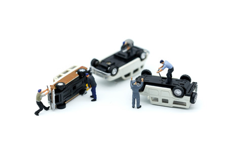 Miniature people :  Technician auto mechanic with a wrench working in garage,Car repairing ,Repair serviceの写真素材