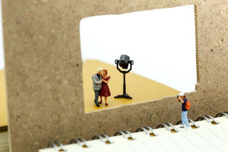 Miniature people : photographer shooting a couple of love.の写真素材