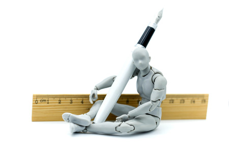 Model robot with pen and ruler.の写真素材