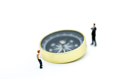 Miniature people : Businessman stand with compass.の写真素材