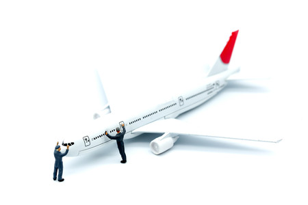 Miniature people : worker or Housewife cleaning on  air plane using for business trip concept.