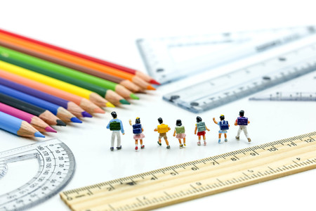 Miniature people : children and student with colorful drawing tools and stationary,education concept.の写真素材