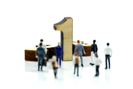 Miniature people : Businessman and team with wooden number of 1,2,3 , to be the first,business competition concept.の写真素材