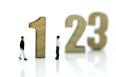 Miniature people : Businessman and team with wooden number of 1,2,3 , to be the first,business competition concept.の写真素材