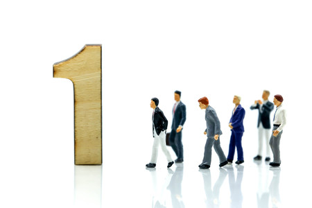 Miniature people : Businessman and team with wooden number of 1,2,3 , to be the first,business competition concept.の写真素材
