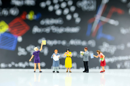 Miniature people : reading a book,Education concept.の写真素材