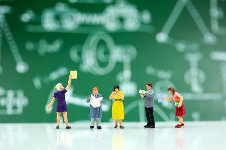 Miniature people : reading a book,Education concept.の写真素材