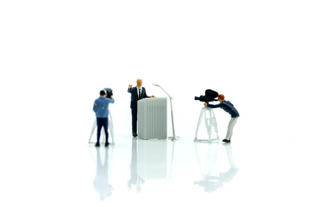 Miniature people : journalists , cameraman ,Videographer at work shooting of the campaignの写真素材