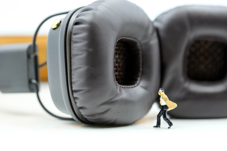 Miniature people : Businessman with Headphones for music studio,business music concept.の写真素材