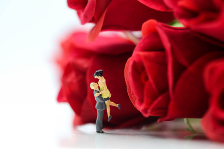 Miniature people : Couple of love with red rose,Lover or valentine's day concept.