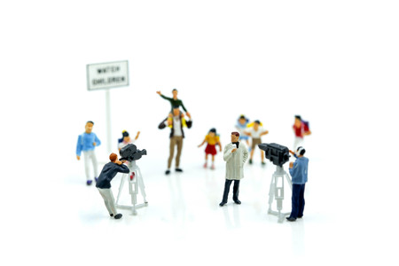 Miniature people : team of tv reporter journalist making an interview a children and students,Education and production television concept.の写真素材
