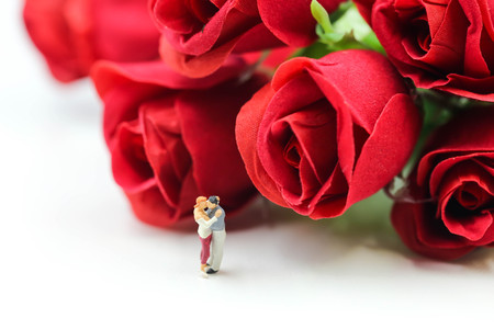 Miniature people : Couple of love with red rose,Lover or valentine's day concept.の写真素材
