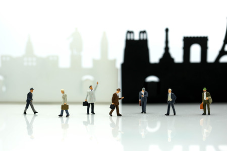 Miniature people : businessman waiting for a taxi in front of the airport,business meeting concept.の写真素材