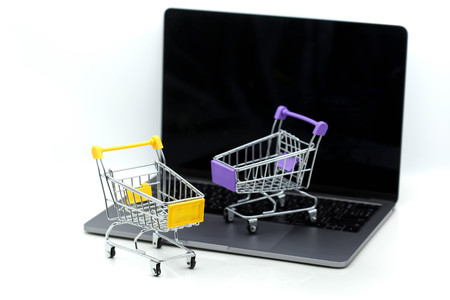 Shopping cart on a laptop,concept about online purchase and shopping.の写真素材