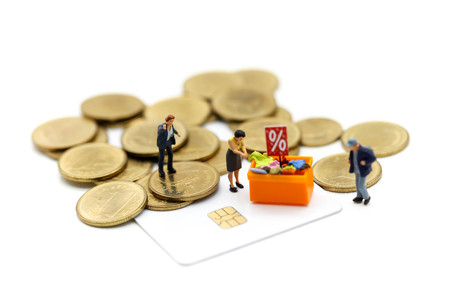 Miniature people : Shoppers with discount for shopping items and coins,Business Shopping concept.の写真素材
