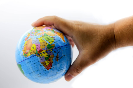 Holding globe world map on hands.