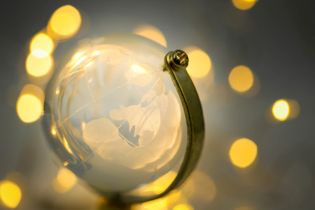 Globe glass of golden lights  bokehの写真素材
