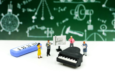 Miniature people : Teacher and student with piano class of music.の写真素材