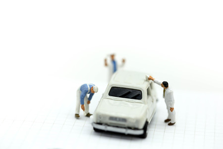 Miniature people : Professional painting car in a paint chamber during.の写真素材