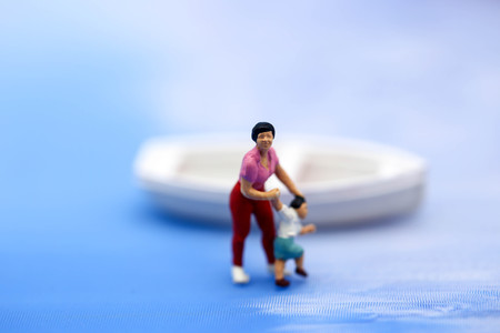 Miniature people : people Paddling boats and Sailing boats,relax and travel concept.