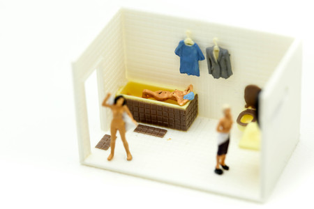 Miniature people : beautiful naked young woman  taking shower in bathroomの写真素材