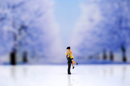 Miniature people : Couple of love with snow winter background,Lover concept.の写真素材