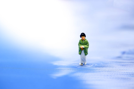 Miniature people : geishas wearing traditional japanese kimono on ice.の写真素材