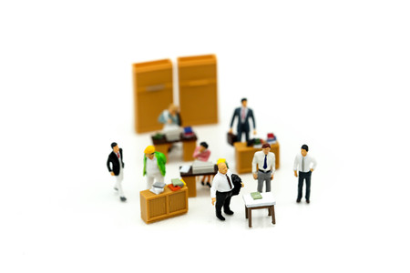 Miniature people : team leader and business owner leading informal in-house business meeting,Business and entrepreneurship concept.の写真素材