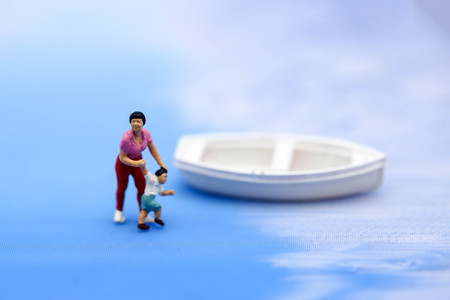 Miniature people : people Paddling boats and Sailing boats,relax and travel concept.の写真素材