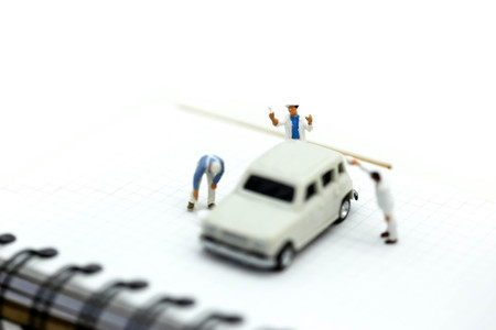 Miniature people : Professional painting car in a paint chamber during.の写真素材