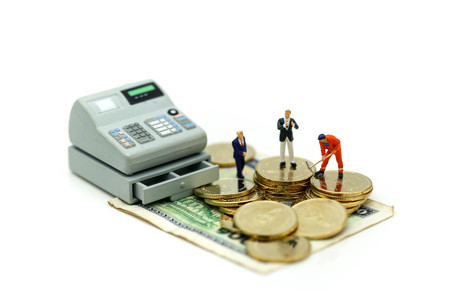 Miniature people : Businessman and construction worker with money,coins,contract of Business Construction concept.の写真素材