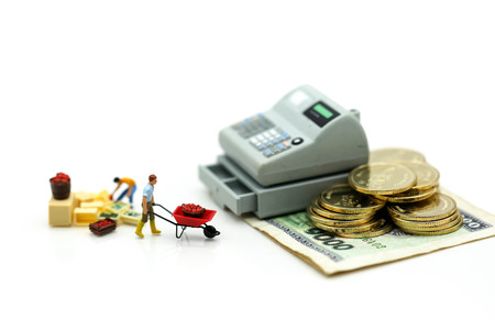 Miniature people : Businessman and construction worker with money,coins,contract of Business Construction concept.の写真素材