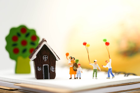 Miniature people : Family and children with colorful ballons with world map,International day of...