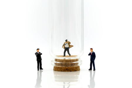 Miniature people : Businessman with friend in bottle,Business competition concept.