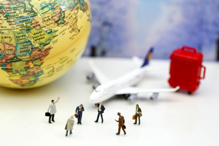 Miniature people : Businessman with airplane,worldmap,luggage of snow winter background.Business Travel concept.の写真素材