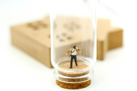 Miniature people : Businessman with friend in bottle,Business competition concept.の写真素材