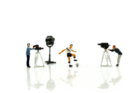 Miniature people : Cameramen, photographers and reporters interviewing football playerの写真素材