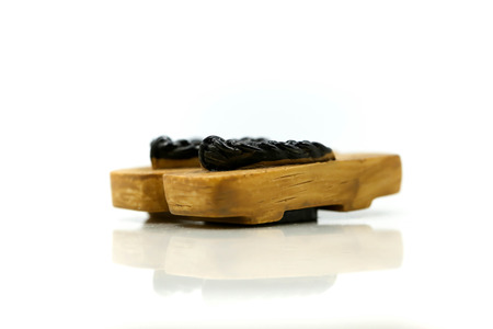 Japanese wooden shoes (geta) on white background.