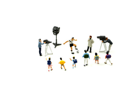 Miniature people : Cameramen, photographers and reporters interviewing football player with children,student.の写真素材