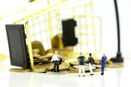 Miniature people : leader and business owner,boss with shopping cart of coins ,failed business sales concept.の写真素材