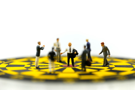 Miniature people : leader and business owner,boss at the target on dart board, concept of success.の写真素材