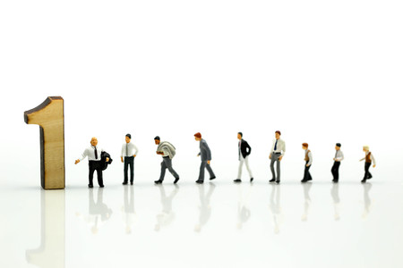 Miniature people : Businessman and team with wooden number of 1,2,3 , to be the first,business competition concept.の写真素材