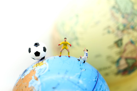 Miniature people : Soccer player man,football world championship cup concept.の写真素材