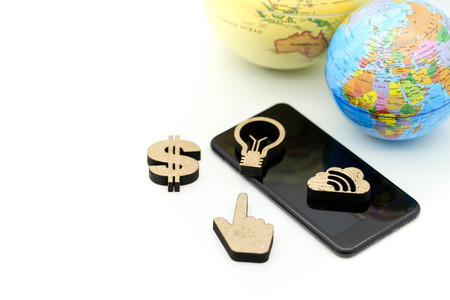 Smart phone with sign of lamp idea, gear, graph and dollar  and world map,Business communication...